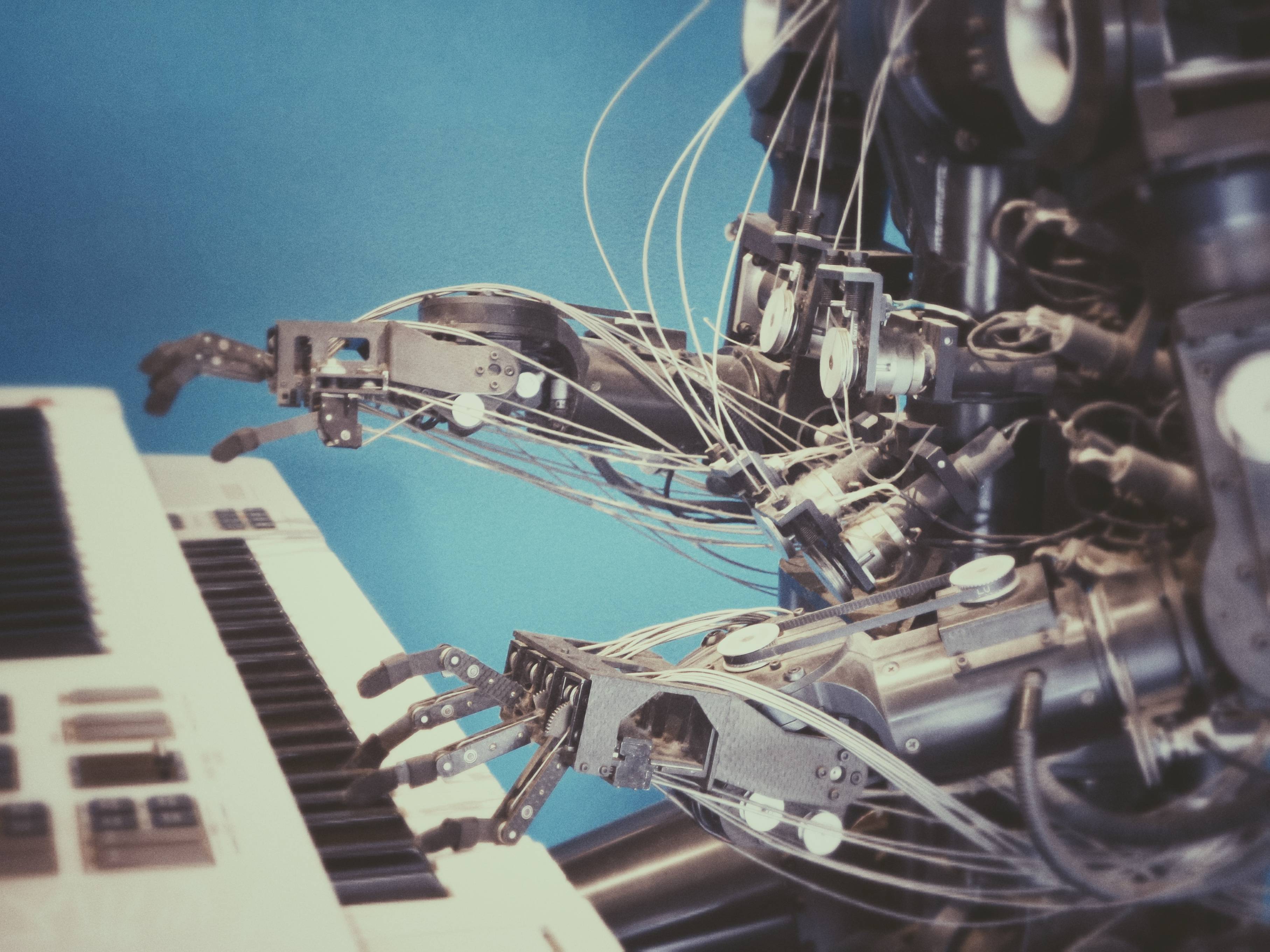 An image of a robot playing a piano.